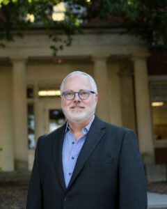 Headshot of Dr. Keith Langston in front of Joe Brown Hall