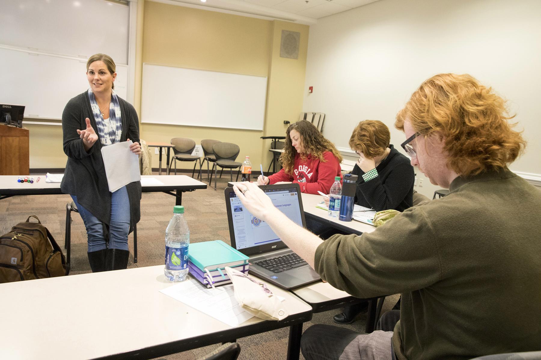 Faculty member speaking to class