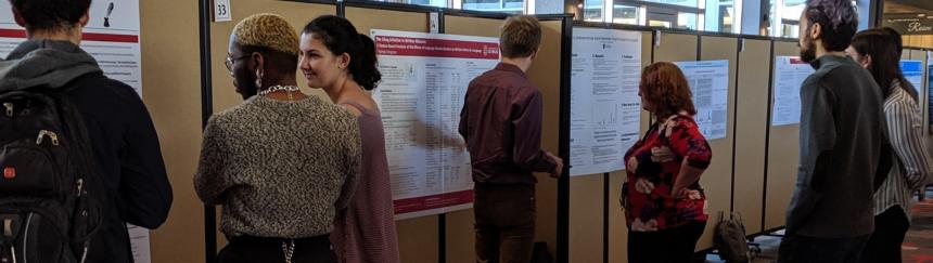 Students presenting posters at conference