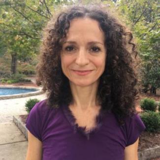 Photograph of Dr. Pilar Chamorro in front of fountain